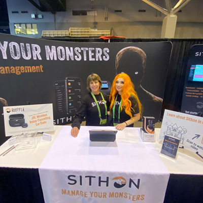 Sithon team members at the booth